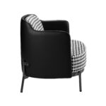 Black and white fabric and black leatherette  armchair