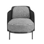 Black and white fabric and black leatherette  armchair