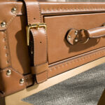 Rectangular leather and golden steel corner table